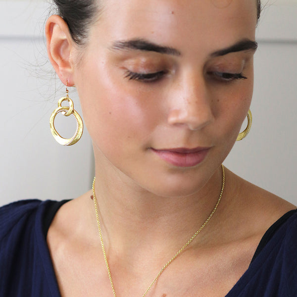 Faux gold linked organic brushed loop drop earrings with silver bead detail