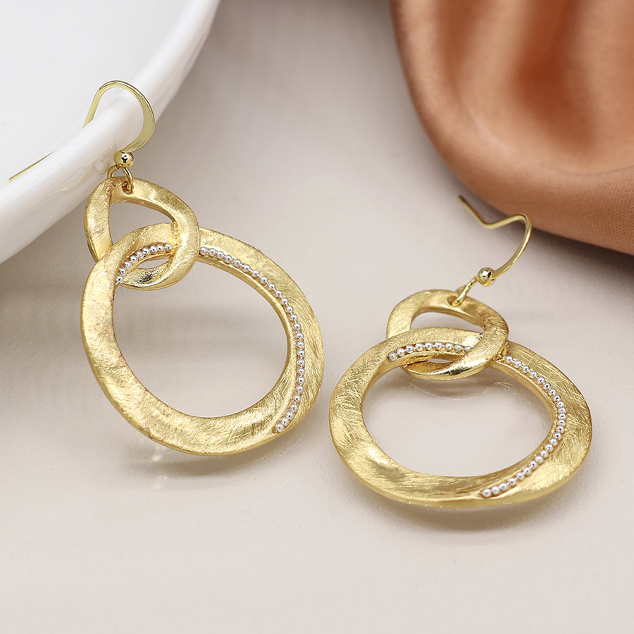 Faux gold linked organic brushed loop drop earrings with silver bead detail