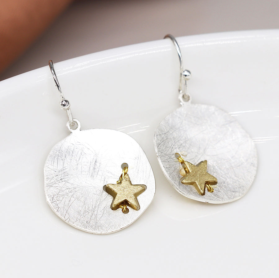 Silver plated scratched finish concave disc earrings with golden star