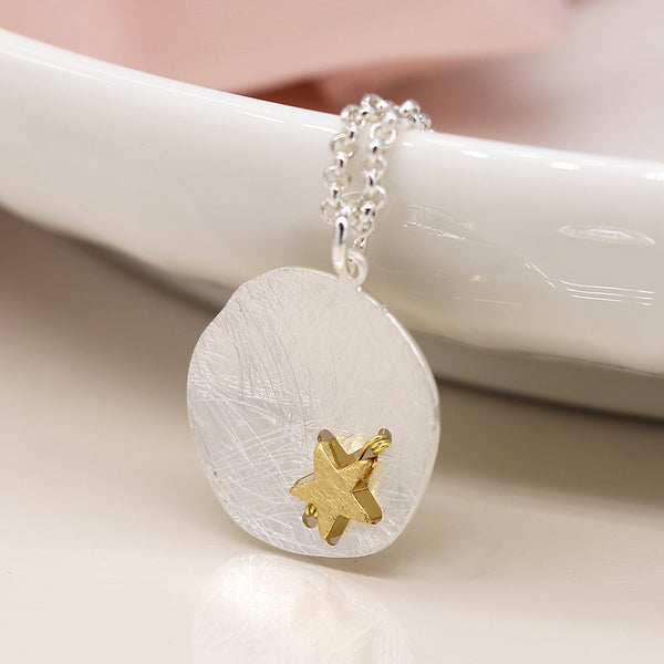 Silver plated scratched finish concave disc necklace with golden star
