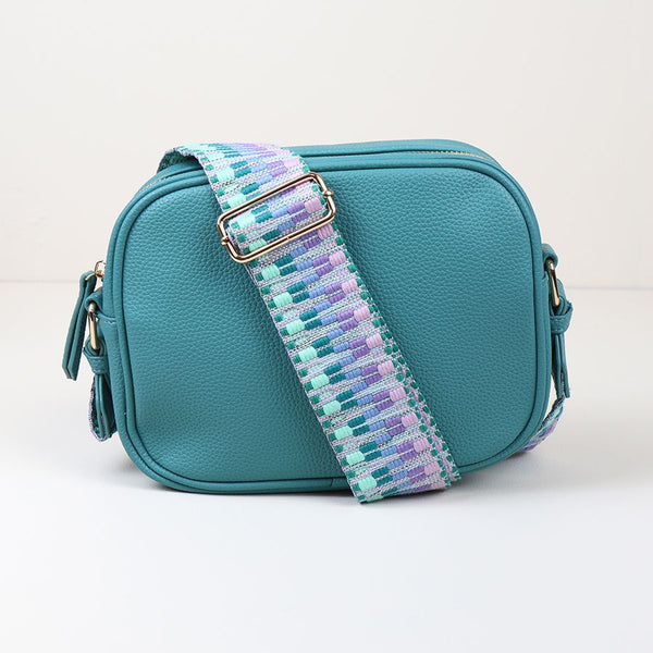 TURQUOISE VEGAN LEATHER CAMERA BAG WITH WOVEN PASTEL MIX STRAP