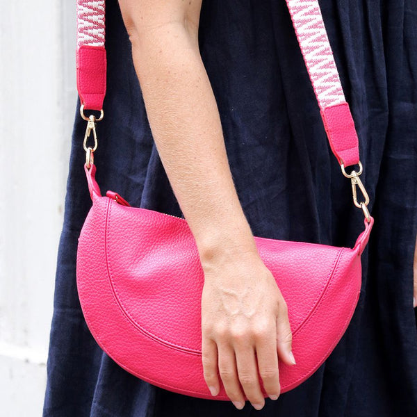 CERISE VEGAN LEATHER HALF MOON BAG WITH WOVEN ZIG ZAG STRAP