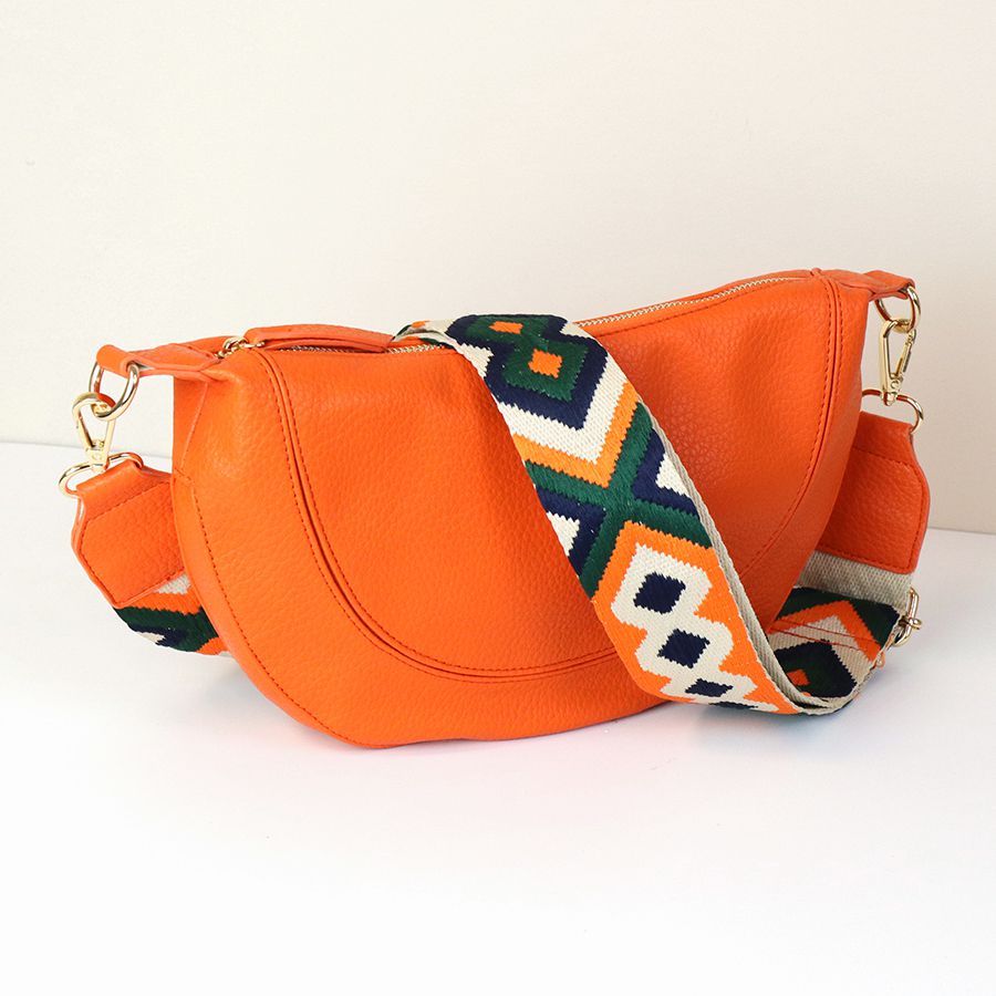 ORANGE VEGAN LEATHER HALF MOON BAG WITH OLIVE/ORANGE DIAMOND WOVEN STRAP