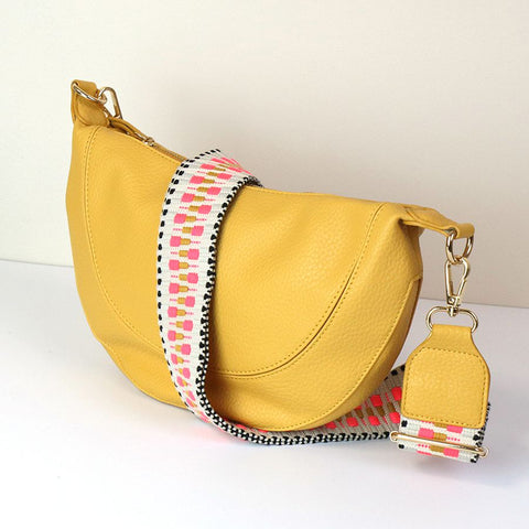 YELLOW VEGAN LEATHER HALF MOON BAG WITH PINK/YELLOW ZIG ZAG STRAP